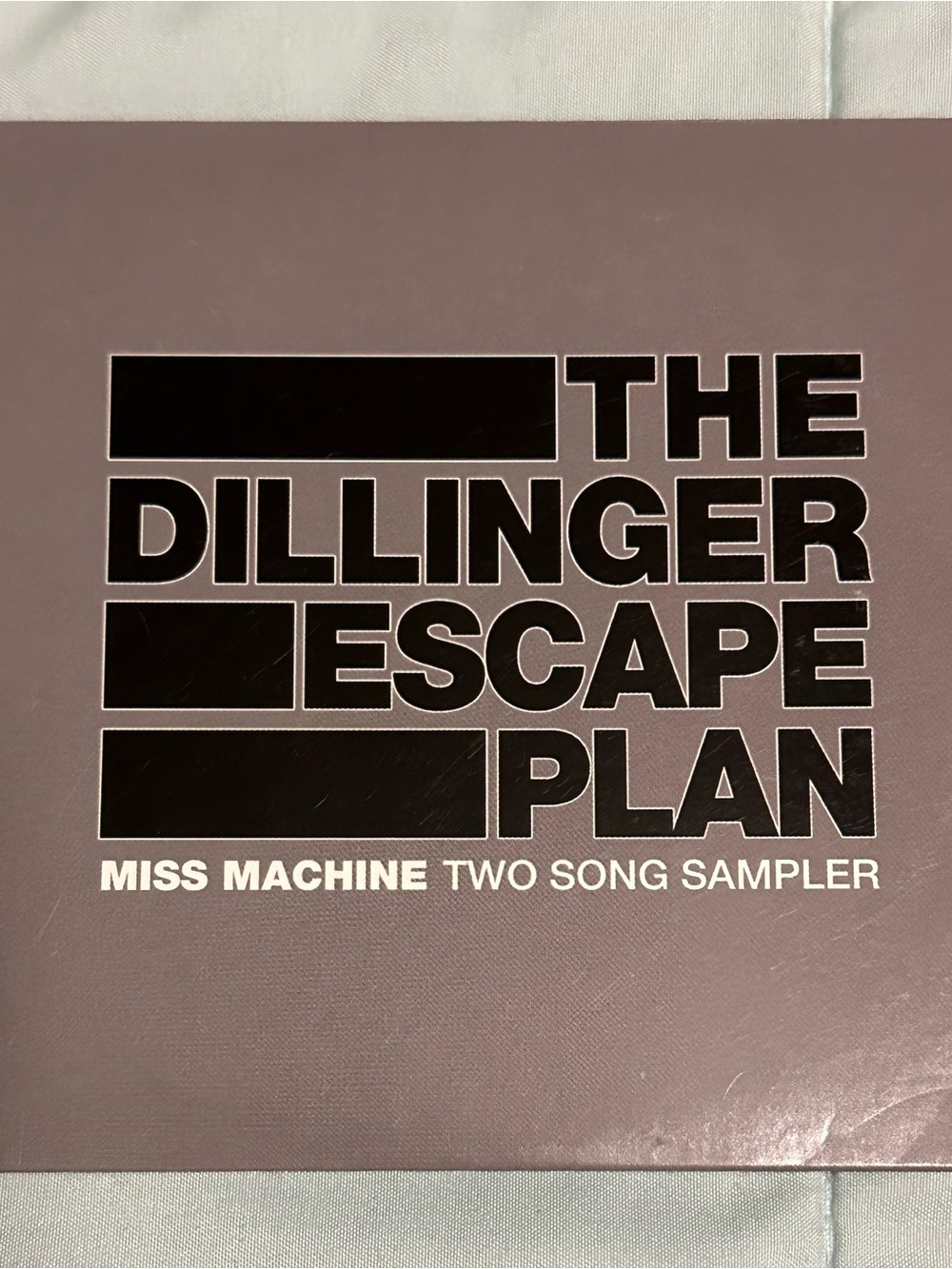 The Dillinger Escape Plan "Miss Machine" Two Song Sampler - Purple Cover